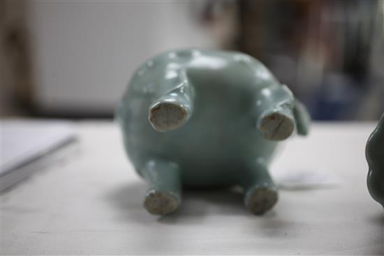 A Chinese celadon-glazed lion-dog censer and cover, 18th century, 17.2cm, wood stand